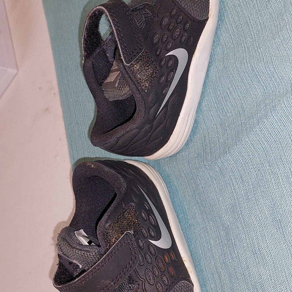 Nike Size 5. Cute little Nikes black and White .Good Condition